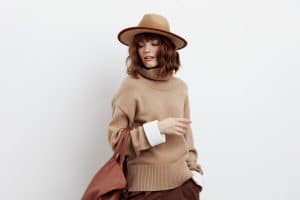 a delightful woman poses a Vacation fashion trends