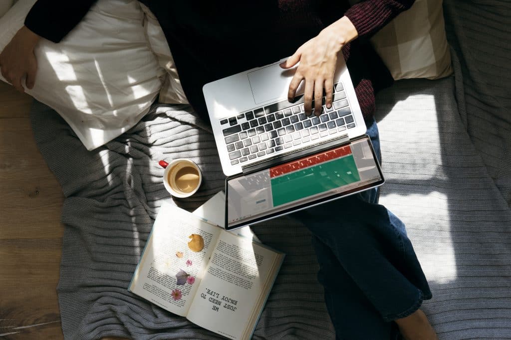 Consumer watching social shopping and livestream content on a laptop.